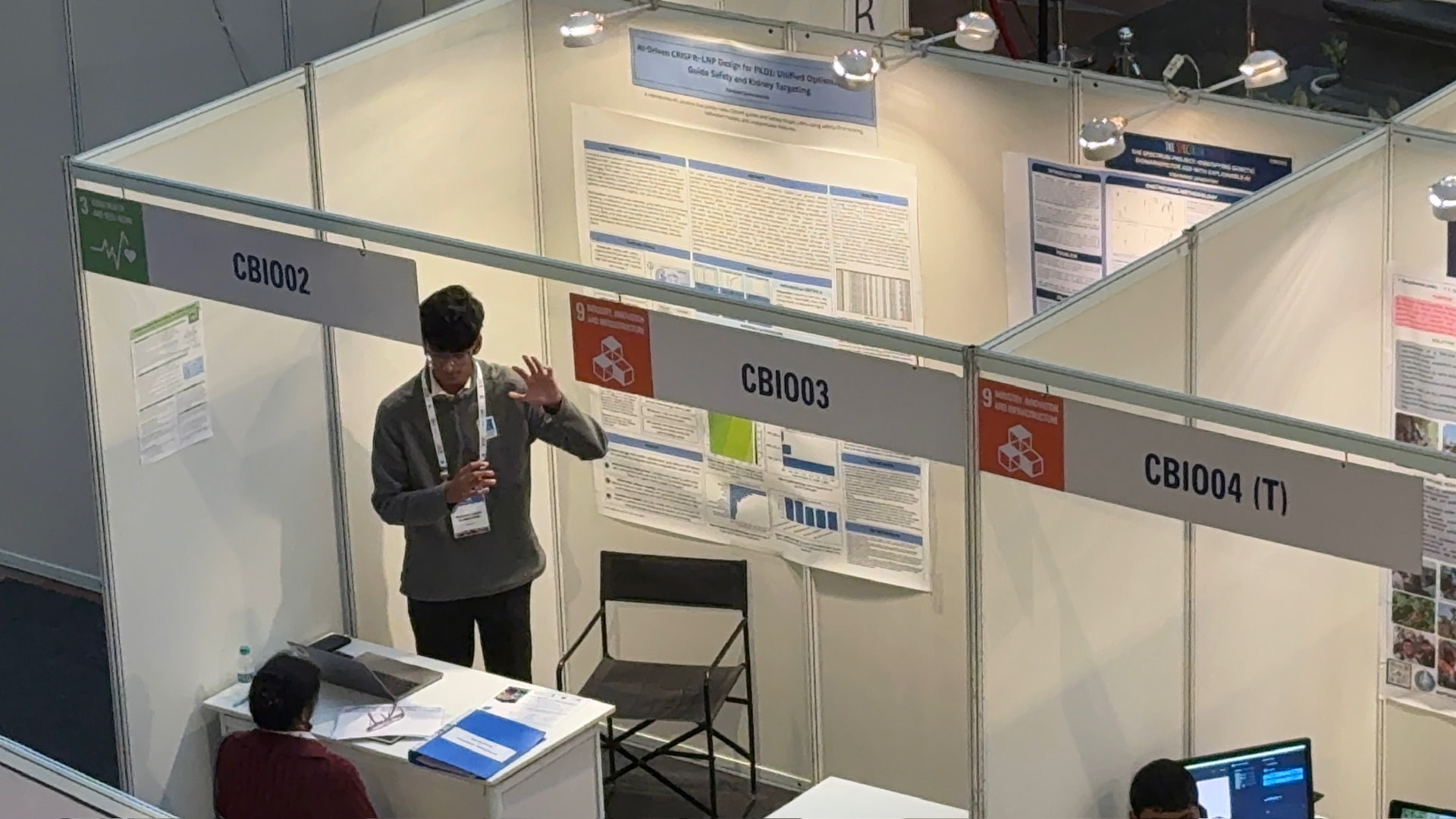 Raksheet Gummakonda presenting his CRISPR delivery research booth at the IRIS National Fair