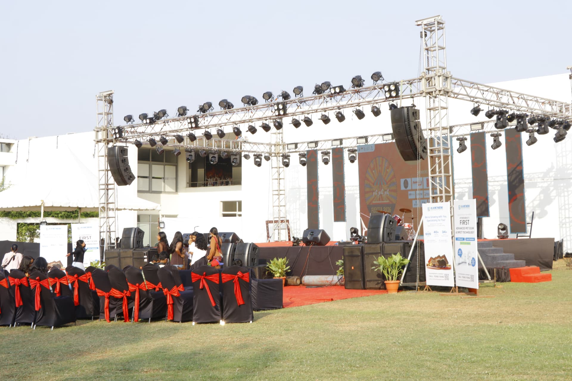 Outdoor Fiesta stage with seating, lighting truss and sponsor banners